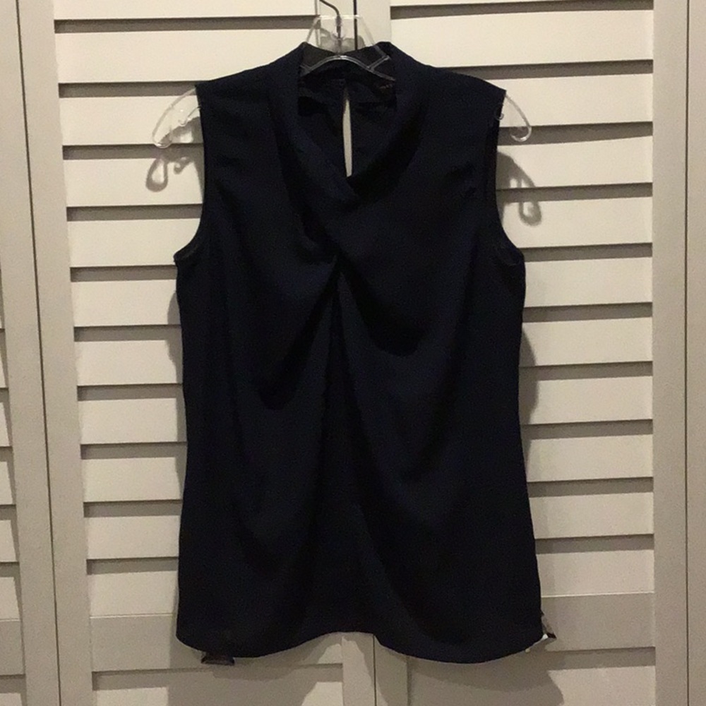 The Limited Pre loved Navy Top in 100% Polyester.